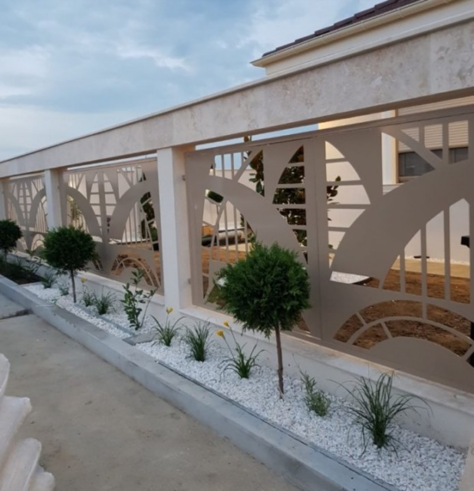 Aluminium fence with decorative perforated pattern